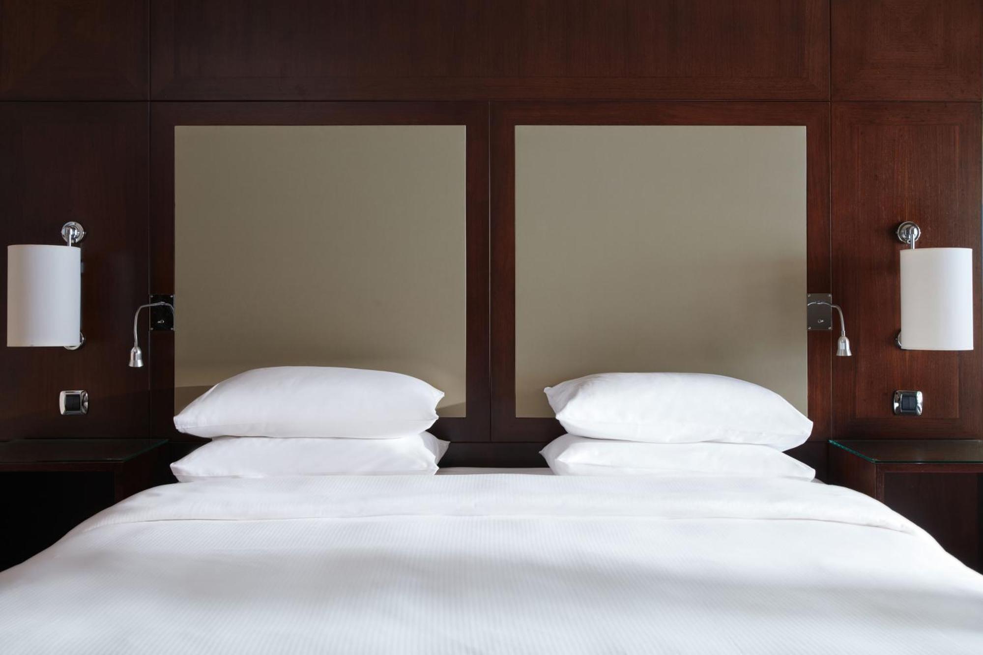 Hyatt Regency Nice Palais De La Mediterranee Exterior photo A bed with two pillows